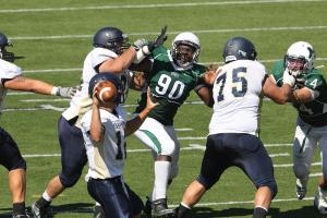David Leisering Photo: Serge Augustin barrels through the Bald Eagle offensive line in the 19-10 win.